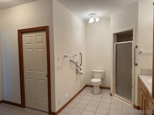 402325 W 2100th Rd, Bartlesville, OK 74006 - bathroom featuring tile patterned floors, a stall shower, toilet, baseboards, and vanity