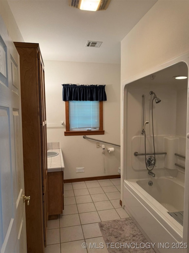 402325 W 2100th Rd, Bartlesville, OK 74006 - bathroom featuring tile patterned flooring, vanity, baseboards,  shower combination, and toilet
