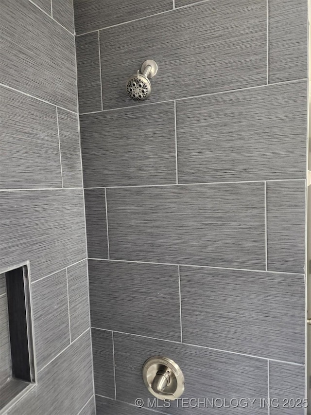 details featuring a tile shower