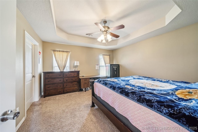 54555 E 340th Rd, Jay, OK 74346 - bedroom featuring light colored carpet, ceiling fan, and a raised ceiling