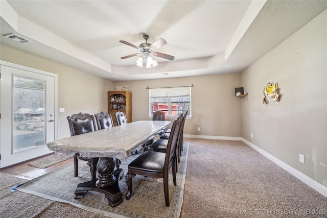 54555 E 340th Rd, Jay, OK 74346 - dining area featuring baseboards, a ceiling fan, visible vents, and a tray ceiling