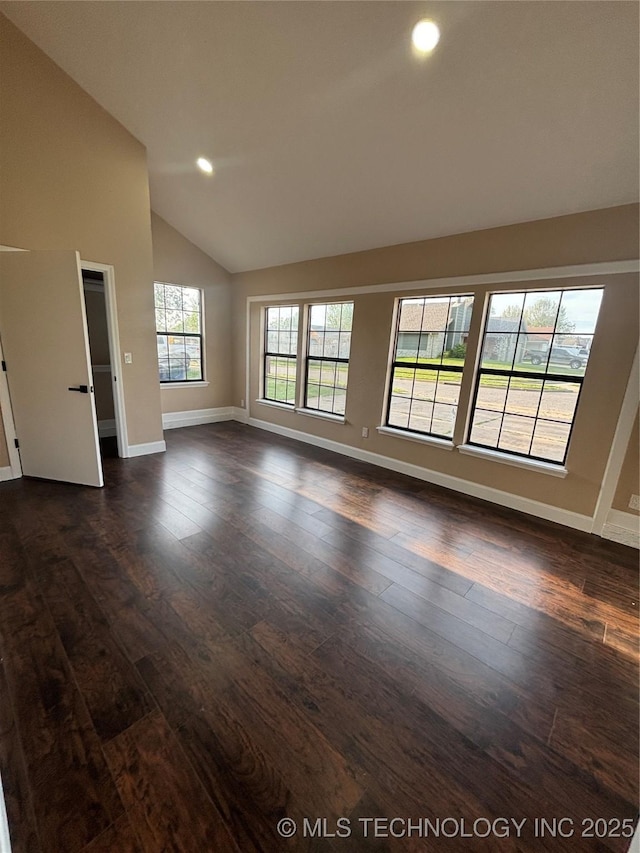 13802 E 19th Pl, Tulsa, OK 74108 - empty room featuring vaulted ceiling, baseboards, recessed lighting, and dark wood-type flooring