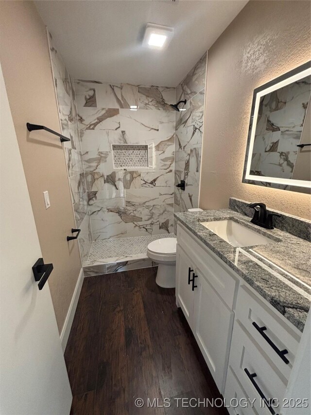 13802 E 19th Pl, Tulsa, OK 74108 - full bathroom with toilet, vanity, wood finished floors, and a marble finish shower