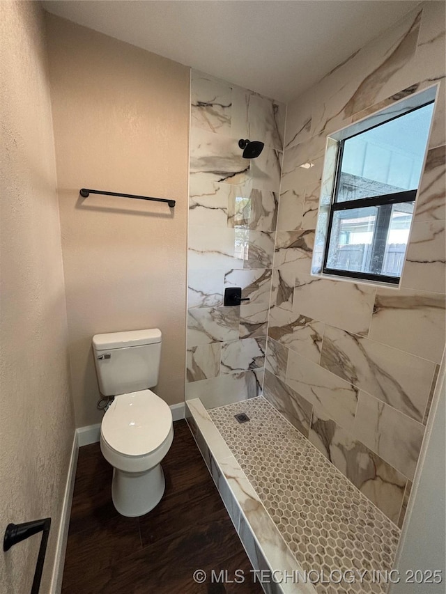 13802 E 19th Pl, Tulsa, OK 74108 - full bath with baseboards, toilet, wood finished floors, and tiled shower