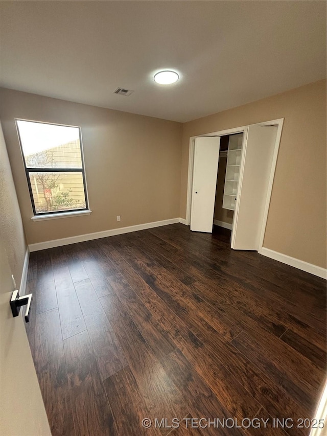 13802 E 19th Pl, Tulsa, OK 74108 - empty room with baseboards, dark wood-style flooring, and visible vents