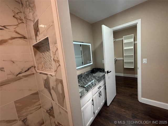 13802 E 19th Pl, Tulsa, OK 74108 - bathroom with baseboards, wood finished floors, a sink, and double vanity