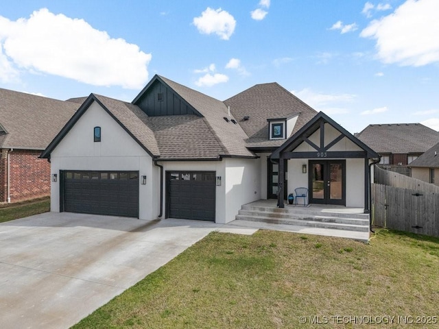 modern inspired farmhouse featuring a front lawn, driveway, french doors, and a garage
