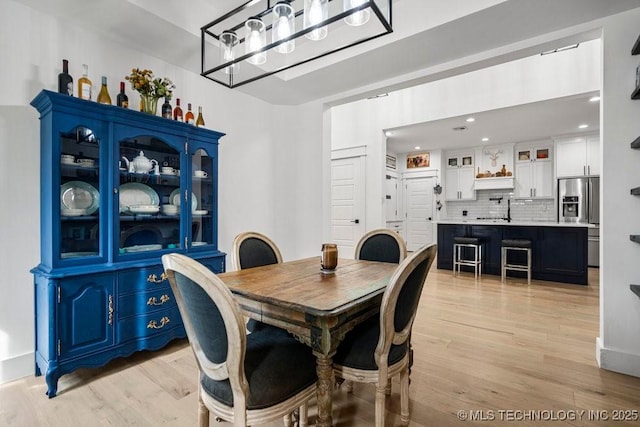 dining area featuring recessed lighting and light wood-type flooring