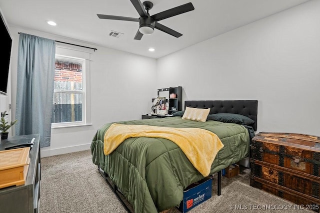 carpeted bedroom featuring ceiling fan, baseboards, visible vents, and recessed lighting