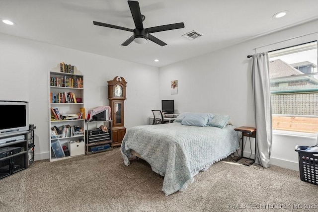 carpeted bedroom featuring a ceiling fan, visible vents, and recessed lighting