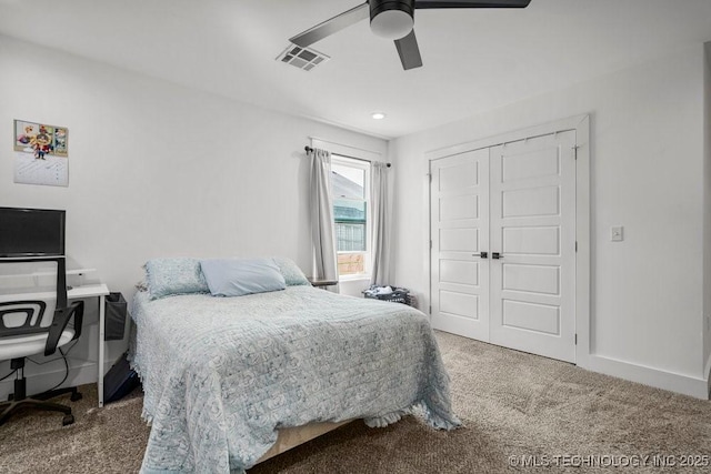 bedroom with a closet, ceiling fan, baseboards, carpet flooring, and visible vents
