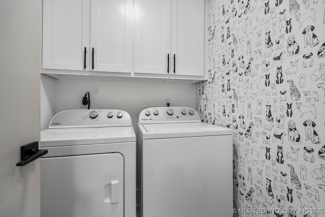 clothes washing area featuring cabinet space and washing machine and clothes dryer