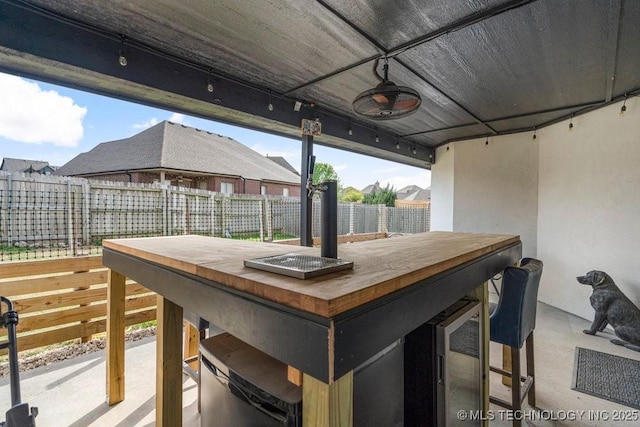 deck featuring outdoor dry bar and fence private yard