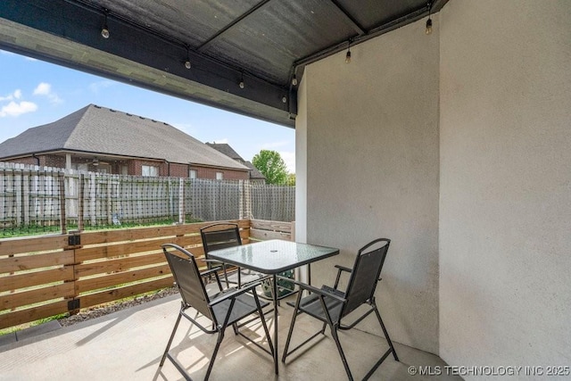 view of patio / terrace featuring outdoor dining area and fence