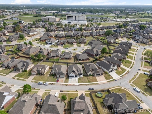 birds eye view of property with a residential view