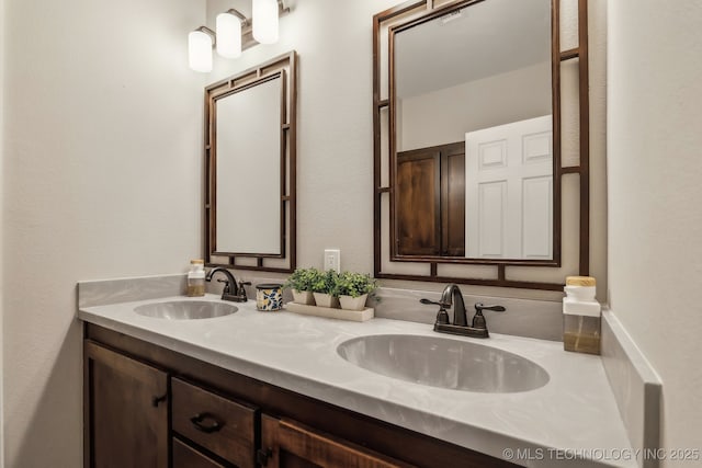bathroom with double vanity and a sink