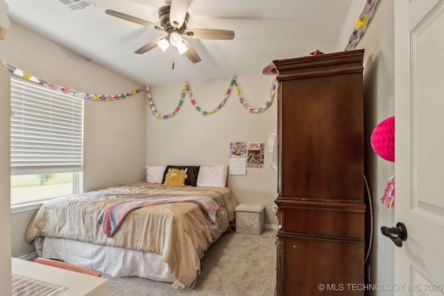 bedroom with ceiling fan, visible vents, and carpet