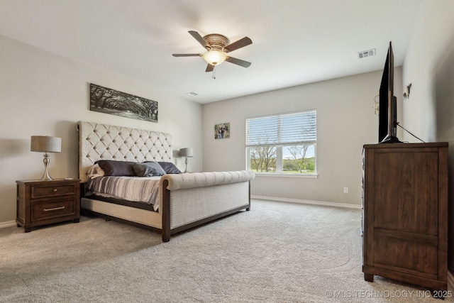 carpeted bedroom featuring a ceiling fan, baseboards, and visible vents