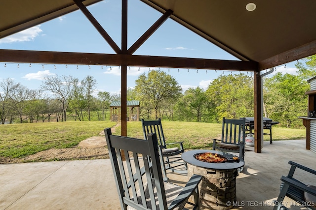 view of patio with grilling area and an outdoor fire pit