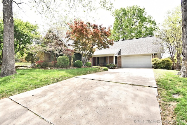 3638 E 69th Pl, Tulsa, OK 74136 - ranch-style house featuring a garage, driveway, a front yard, and brick siding