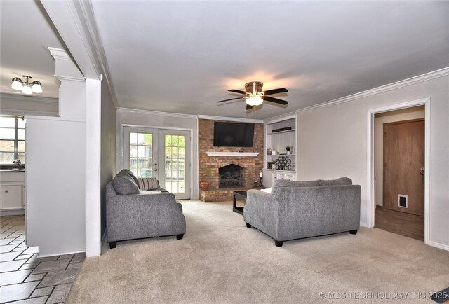 3638 E 69th Pl, Tulsa, OK 74136 - living room featuring french doors, carpet floors, crown molding, a brick fireplace, and ceiling fan