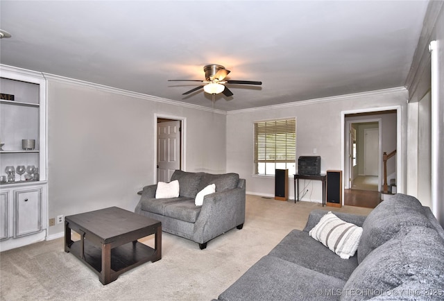 3638 E 69th Pl, Tulsa, OK 74136 - living area with carpet, stairway, a ceiling fan, crown molding, and baseboards