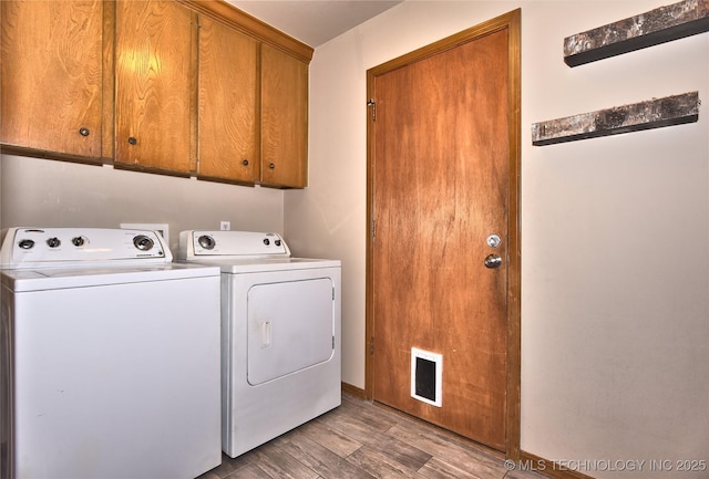 3638 E 69th Pl, Tulsa, OK 74136 - clothes washing area with cabinet space, wood finished floors, washing machine and clothes dryer, and baseboards