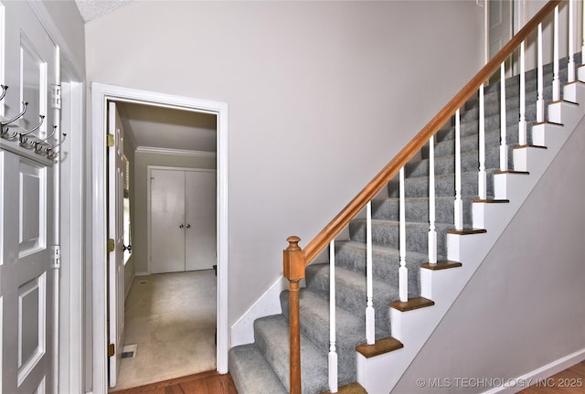 3638 E 69th Pl, Tulsa, OK 74136 - stairway with baseboards, wood finished floors, and crown molding