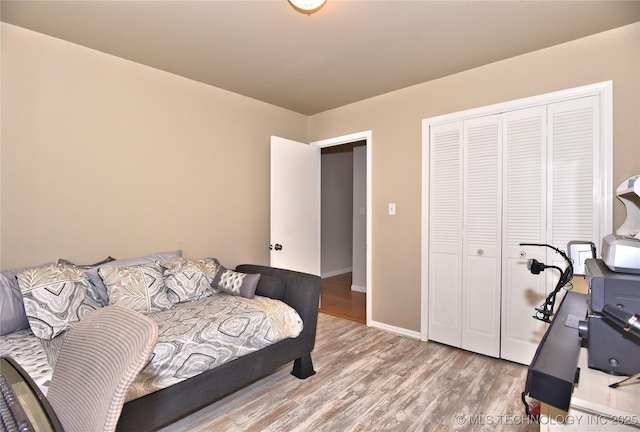 3638 E 69th Pl, Tulsa, OK 74136 - bedroom with wood finished floors, a closet, and baseboards
