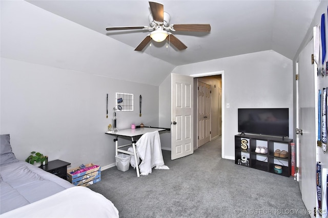 3638 E 69th Pl, Tulsa, OK 74136 - carpeted bedroom with vaulted ceiling, a ceiling fan, and baseboards