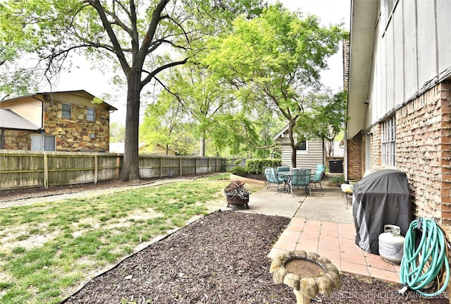 3638 E 69th Pl, Tulsa, OK 74136 - view of yard featuring a fenced backyard, an outdoor fire pit, and a patio