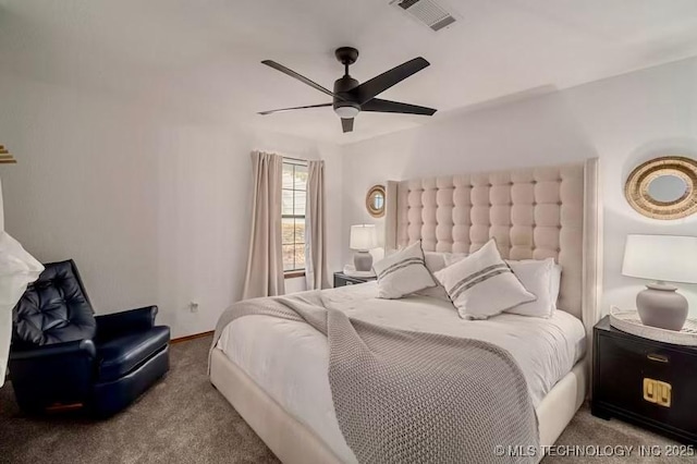bedroom with carpet floors, visible vents, and a ceiling fan