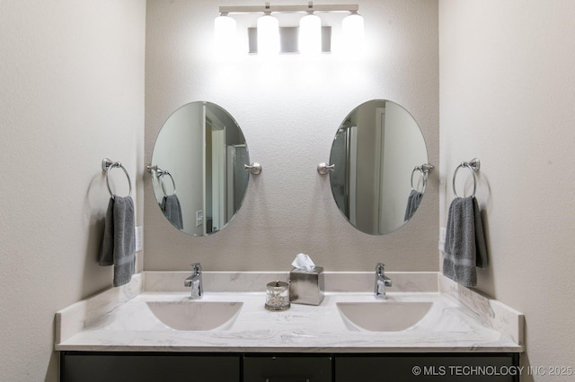 bathroom featuring double vanity and a sink