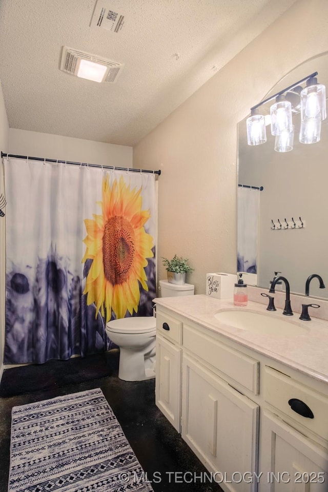 3745 E 420th Rd, Adair, OK 74330 - full bath with a textured ceiling, visible vents, toilet, and vanity