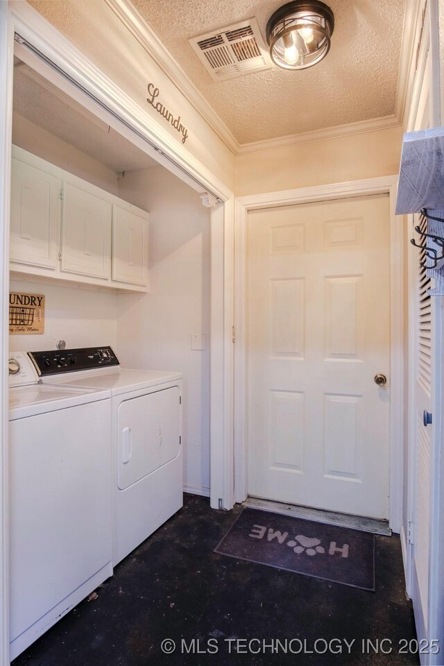 3745 E 420th Rd, Adair, OK 74330 - clothes washing area featuring washer and clothes dryer, a textured ceiling, visible vents, cabinet space, and ornamental molding
