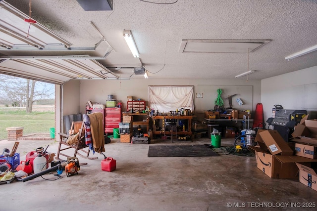 3745 E 420th Rd, Adair, OK 74330 - garage with a workshop area and a garage door opener