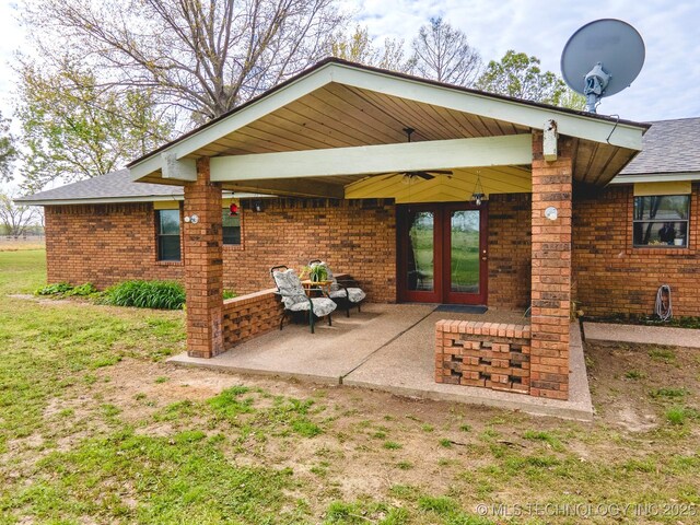 3745 E 420th Rd, Adair, OK 74330 - back of house with brick siding, roof with shingles, a patio, and french doors