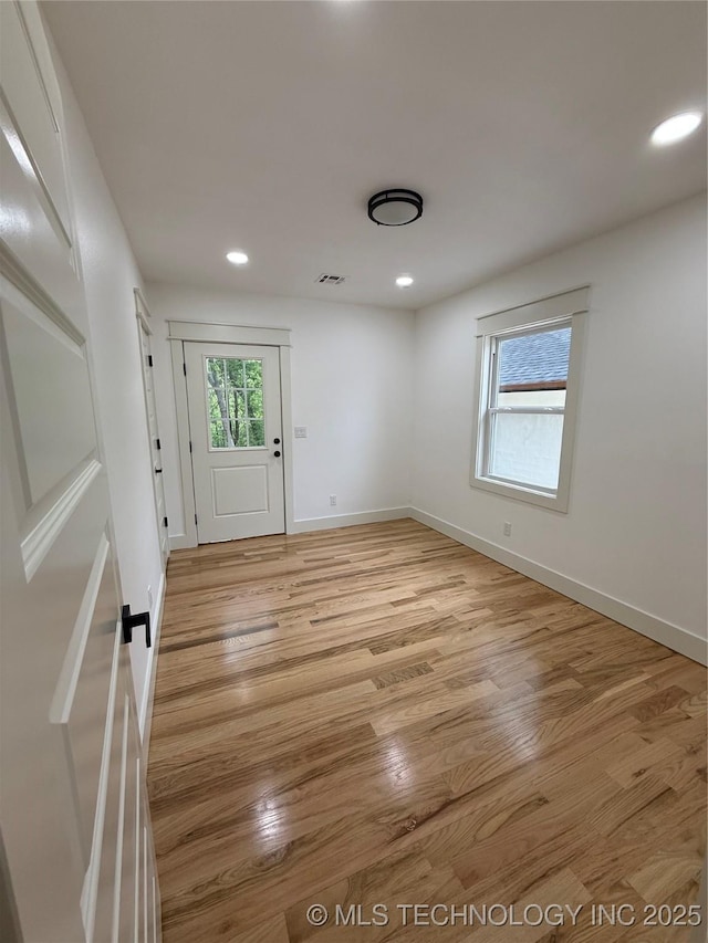 interior space featuring recessed lighting, baseboards, visible vents, and light wood-type flooring