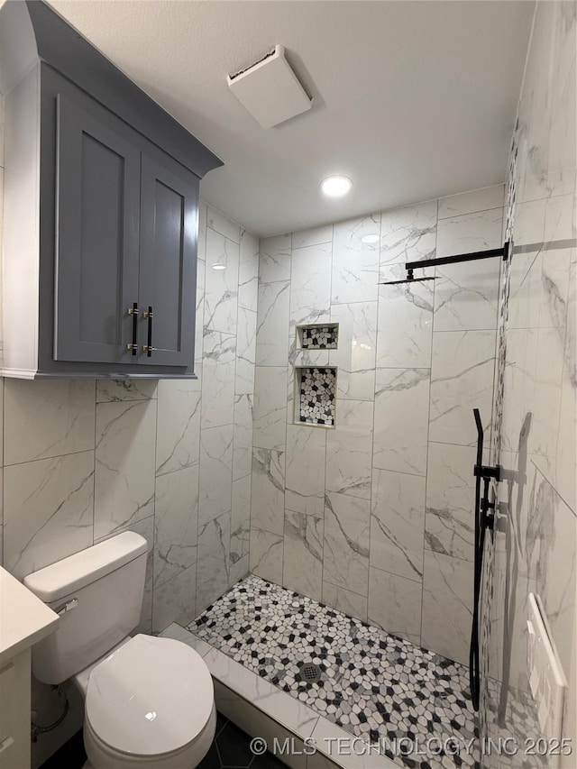bathroom with vanity, recessed lighting, a shower stall, and toilet