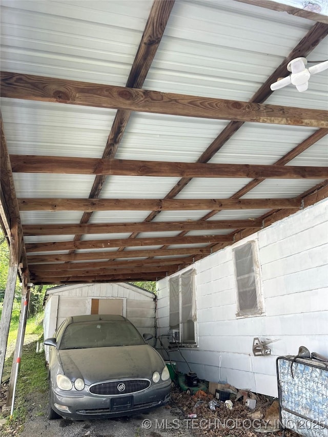 view of parking / parking lot featuring a carport