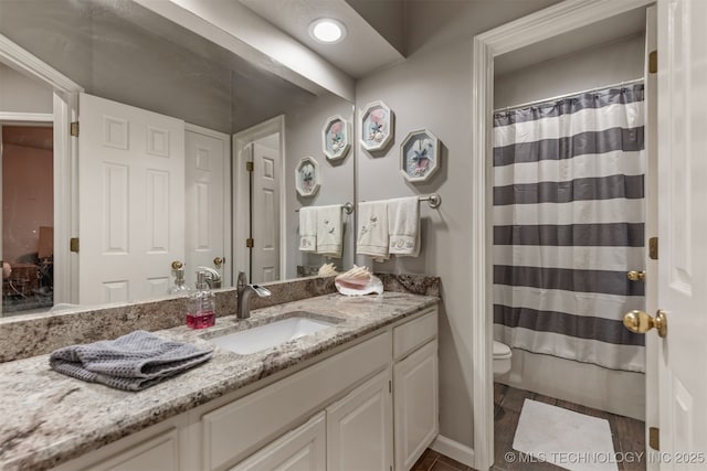 full bath with vanity, toilet, and a shower with shower curtain