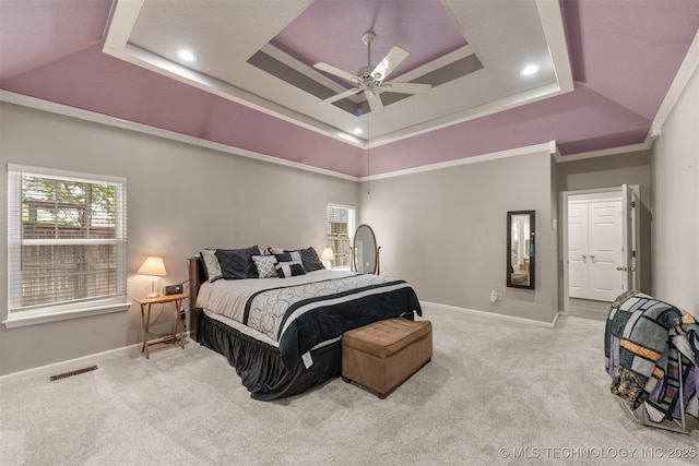 carpeted bedroom featuring a ceiling fan, baseboards, recessed lighting, a tray ceiling, and visible vents