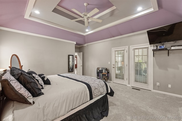 bedroom featuring a ceiling fan, a tray ceiling, visible vents, access to outside, and carpet floors
