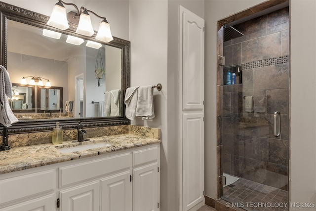 full bathroom featuring vanity and a shower stall
