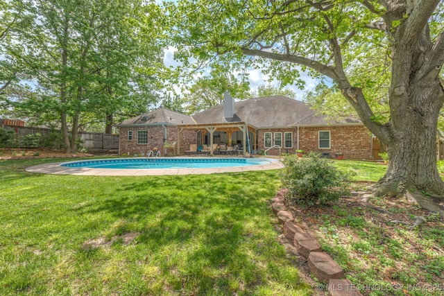 view of pool featuring a fenced backyard, a fenced in pool, a lawn, and a patio