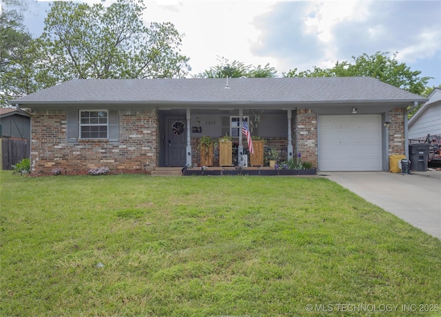 ranch-style house featuring brick siding, an attached garage, a front lawn, and concrete driveway