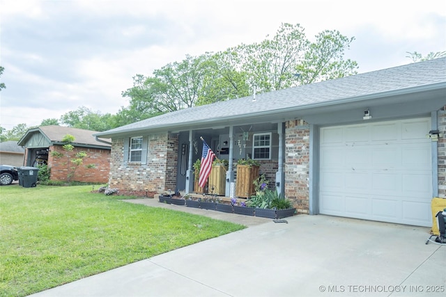 ranch-style home featuring a garage, brick siding, a front yard, and concrete driveway