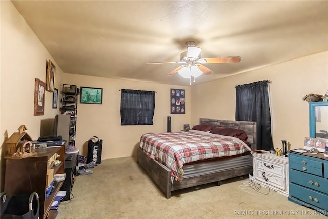 carpeted bedroom with a ceiling fan