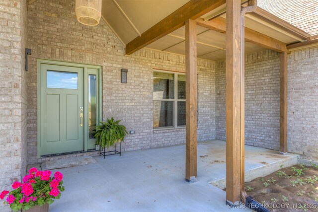 18576 N Jamestown Ave, Skiatook, OK 74070 - view of exterior entry featuring brick siding and covered porch