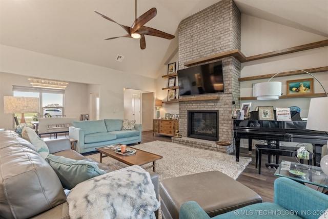 18576 N Jamestown Ave, Skiatook, OK 74070 - living room featuring a ceiling fan, visible vents, high vaulted ceiling, wood finished floors, and a fireplace